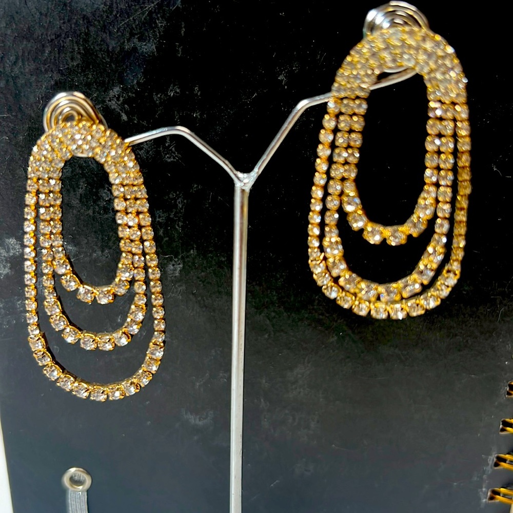 White and Silver tone earrings